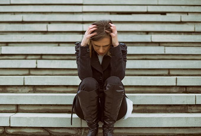 Women sitting on step upset